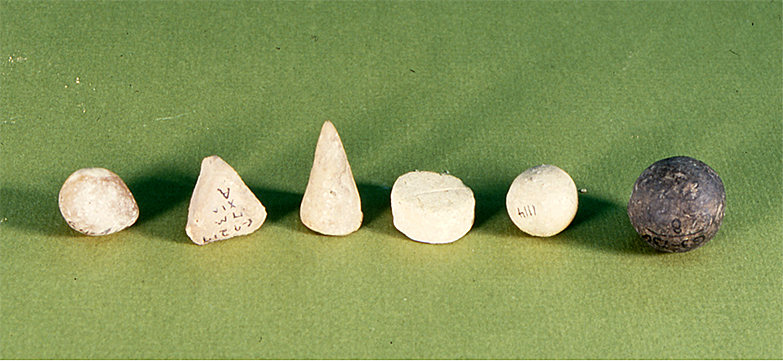 Ancient Messopotamian clay solid shape Tokens sometimes called counters or game pieces